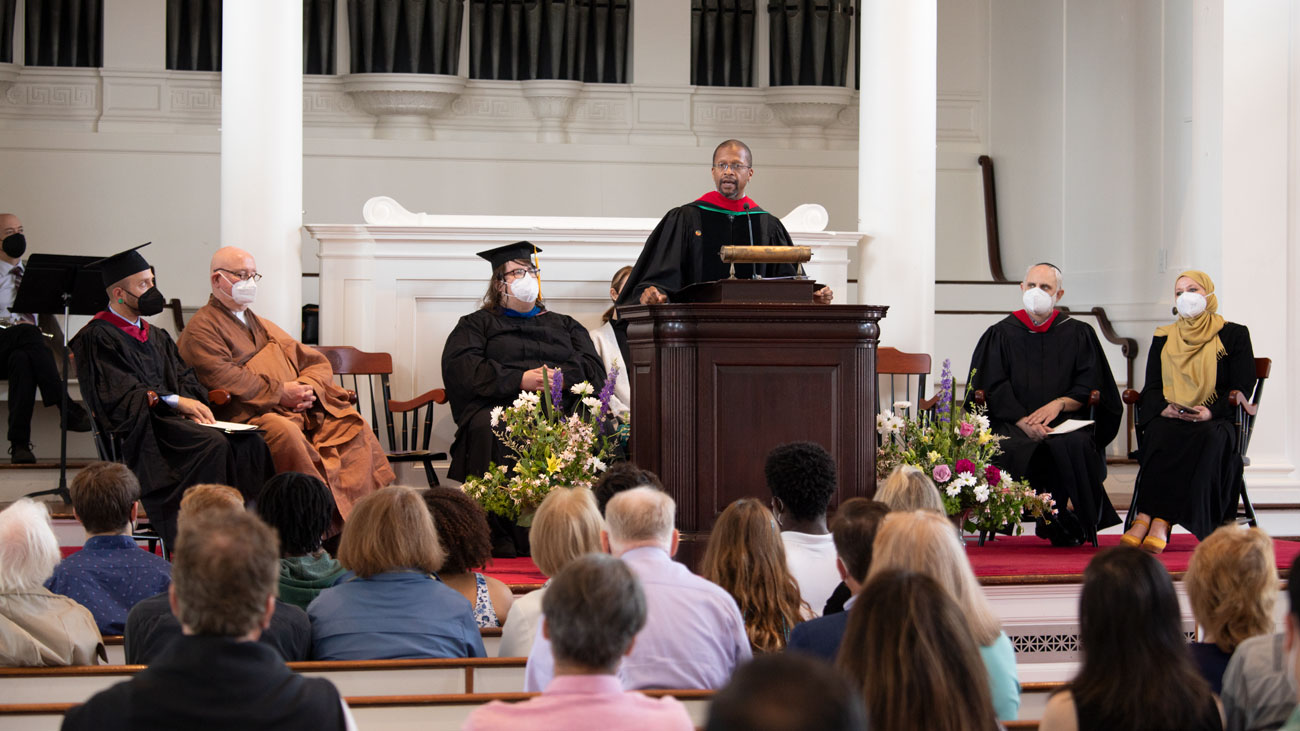 Rev. Adam Lawrence Dyer speaking at the podium in Johnson Chapel