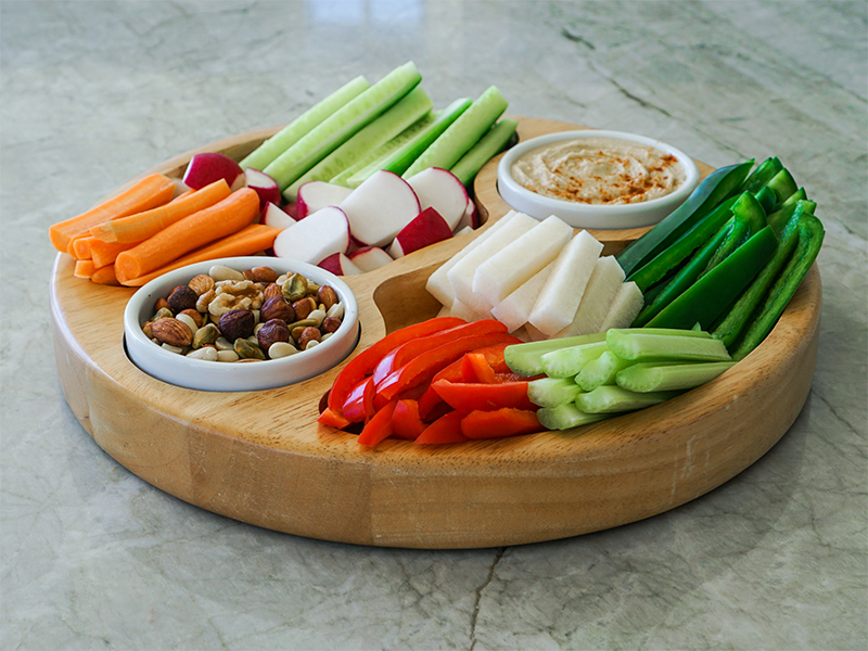 A crudités platter with nuts and dip