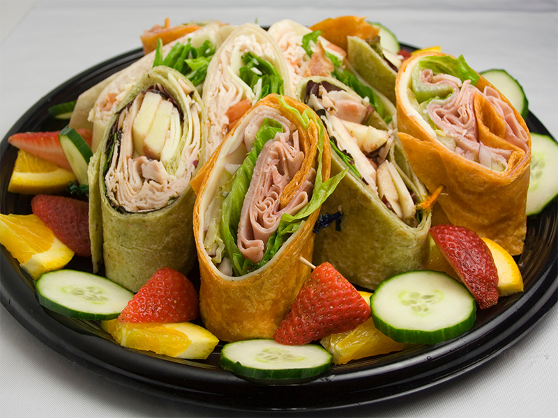 A platter of sandwich wraps