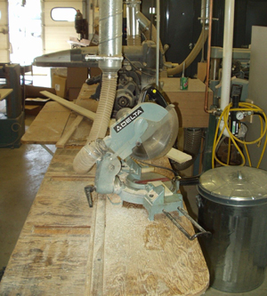 A power saw on a wooden work table