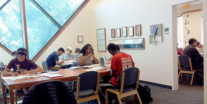 Students studying together at a large table