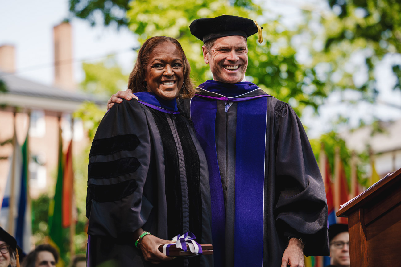 Adrienne White-Faines on stage with President Elliott at Commencement