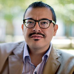 A photo of a man in glasses with a goatee