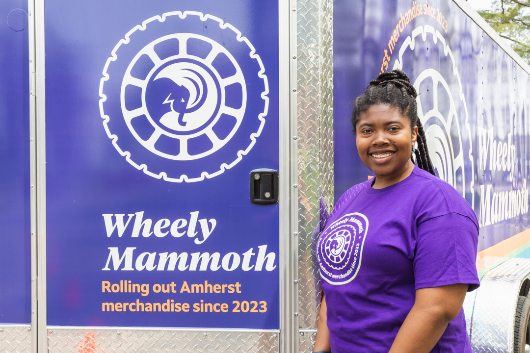 Deanine Dilworth ‘23 stands beside the trailer that she suggested the winning name for.