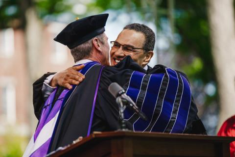 President Elliott hugs Freeman Hrabowski after presenting him his honorary degree