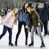 Three students posing on ice skates